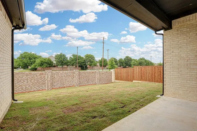 a view of balcony with wooden fence