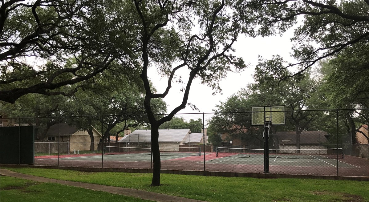 7922 Ridgeline North Austin, TX 78759 - Photo 29 of 31 The HOA tennis/pickleball/ courts with basketball hoop.