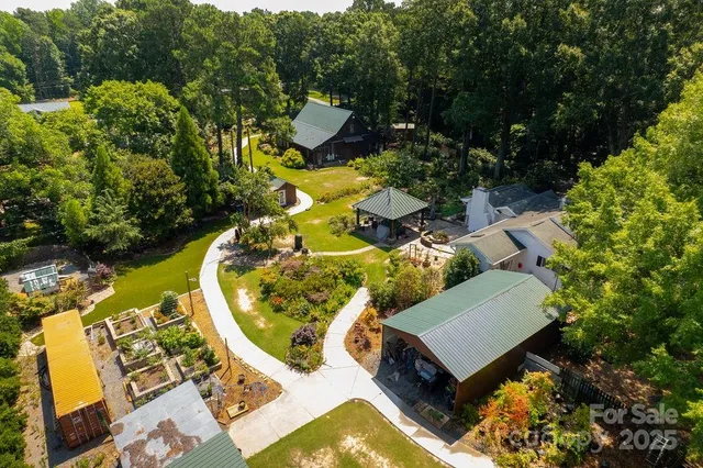 a patio with table and chairs under an umbrella