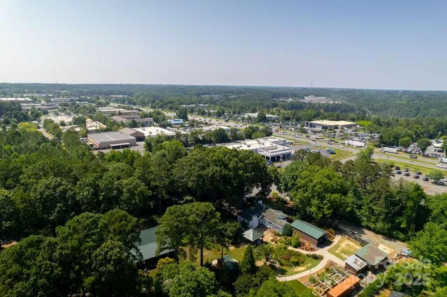 an aerial view of multiple house with yard