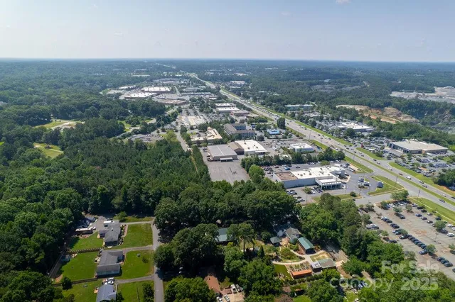 a kitchen with stainless steel appliances a sink a stove and cabinets