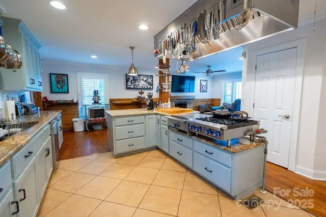 a kitchen with a stove and cabinets