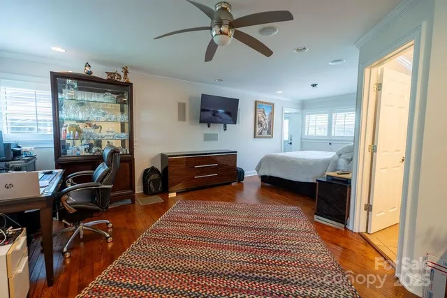 a bathroom with a granite countertop sink toilet and mirror
