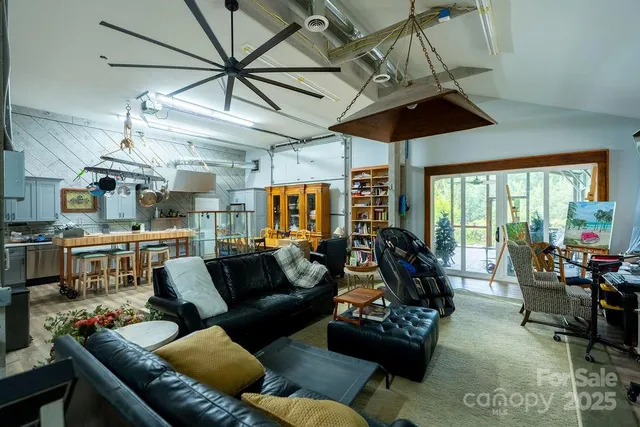 a dining room with furniture and a chandelier