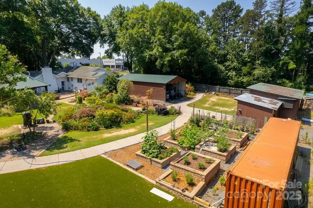 an aerial view of a house with swimming pool