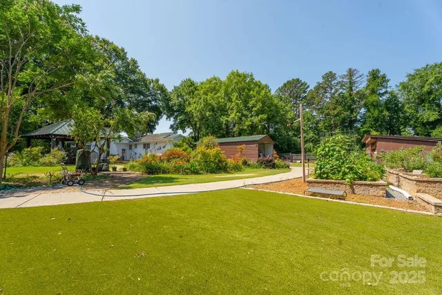 a view of a swimming pool with an outdoor seating and a yard