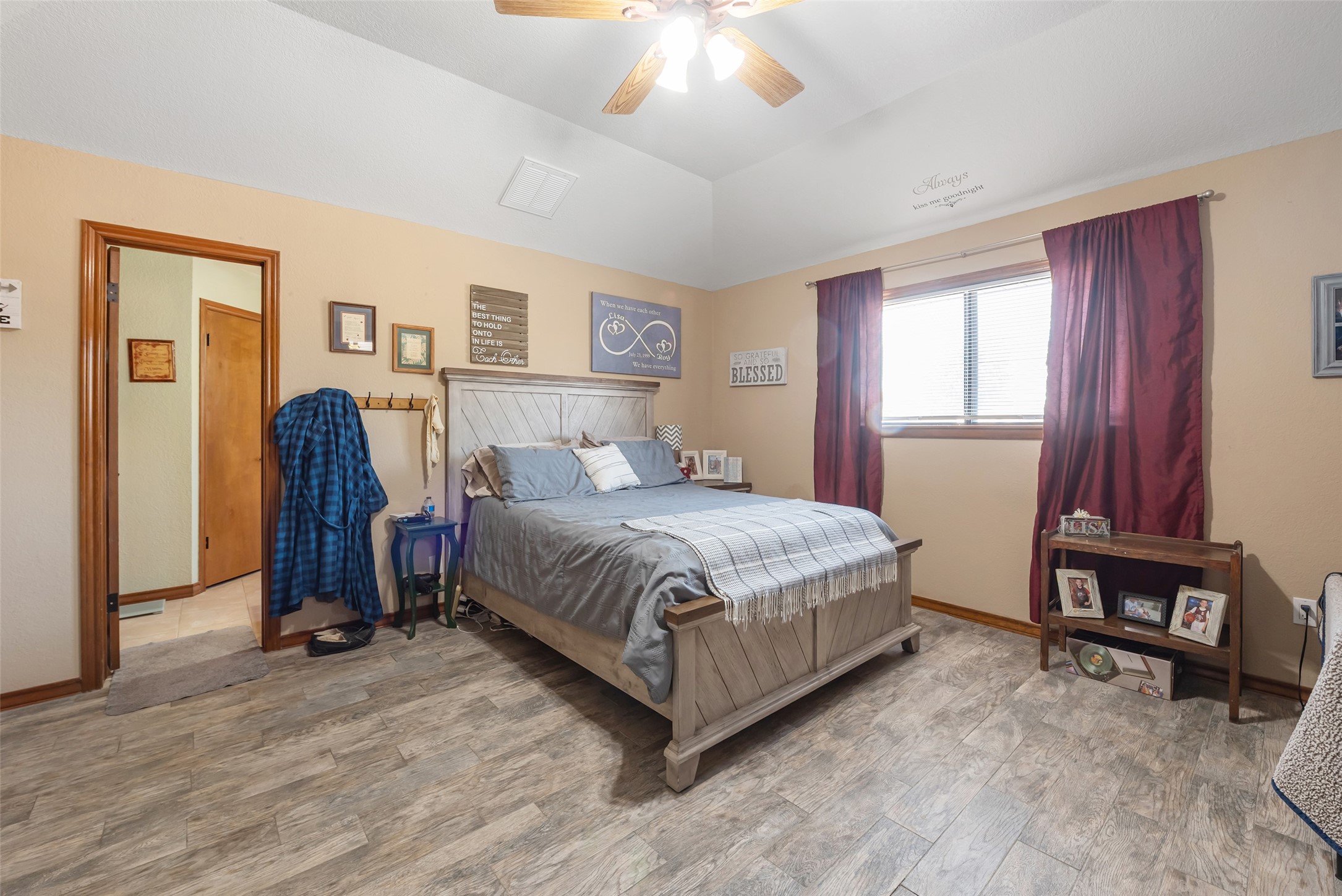 1014 Ginger Street Santa Fe, TX 77517 - Photo 17 of 50 a bedroom with a bed and a chandelier