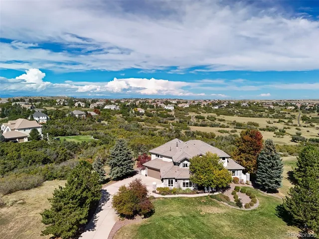 an aerial view of a house with a garden