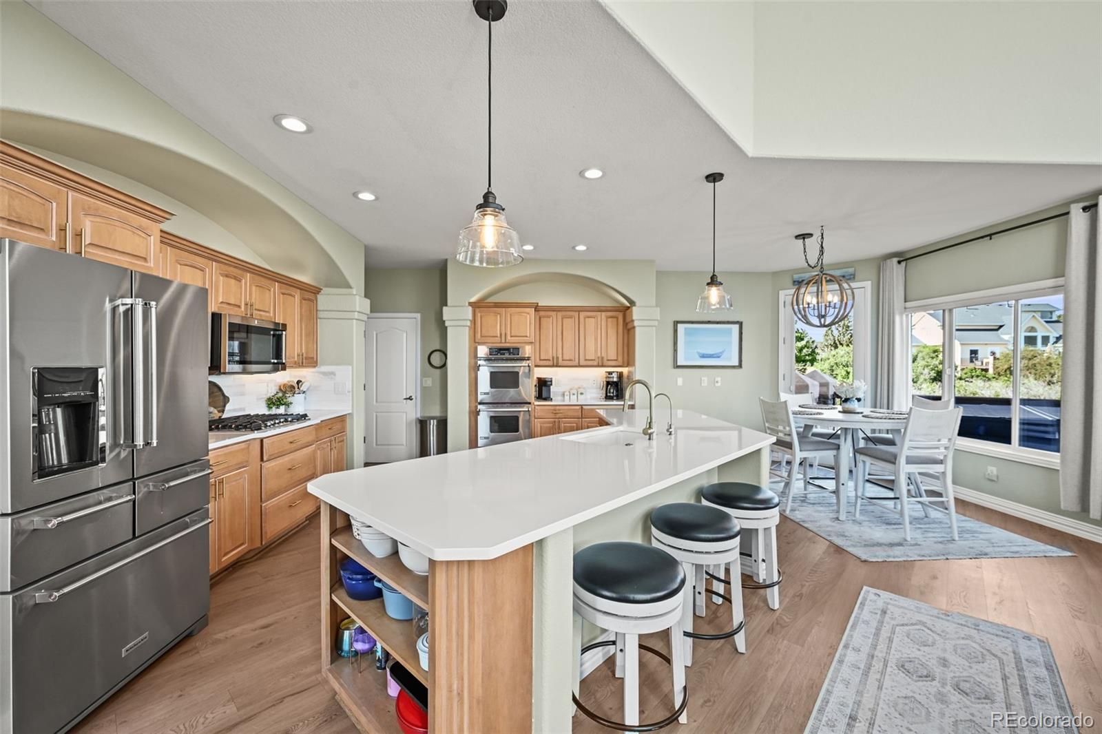 1289 Diamond Ridge Circle Castle Rock, CO 80108 - Photo 12 of 50 a large kitchen with a table and chairs