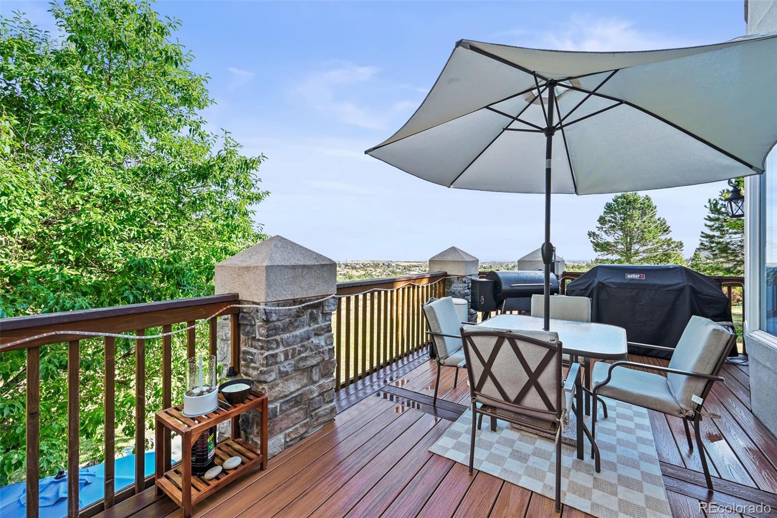 1289 Diamond Ridge Circle Castle Rock, CO 80108 - Photo 18 of 50 a view of balcony with furniture and wooden floor