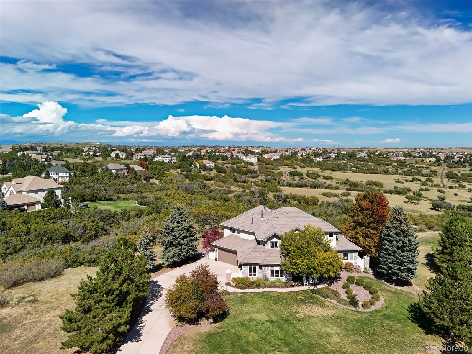 1289 Diamond Ridge Circle Castle Rock, CO 80108 - Photo 2 of 50 an aerial view of a house with a garden