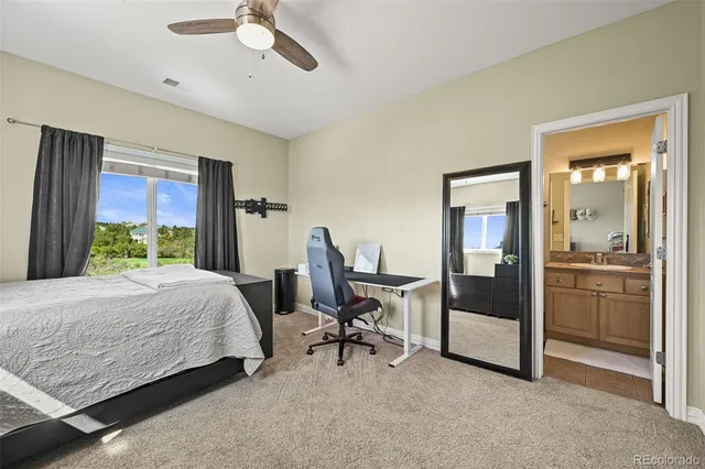 a living room with furniture pool table and a large window