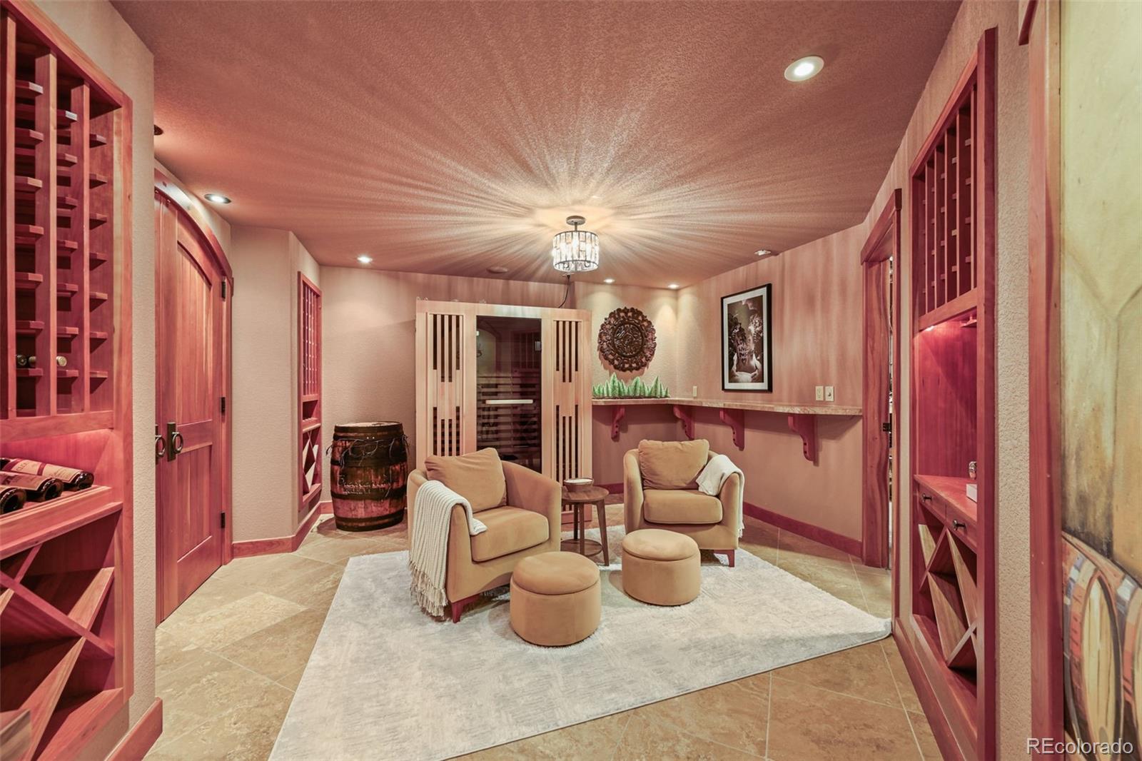 1289 Diamond Ridge Circle Castle Rock, CO 80108 - Photo 27 of 50 a living room with furniture and a chandelier