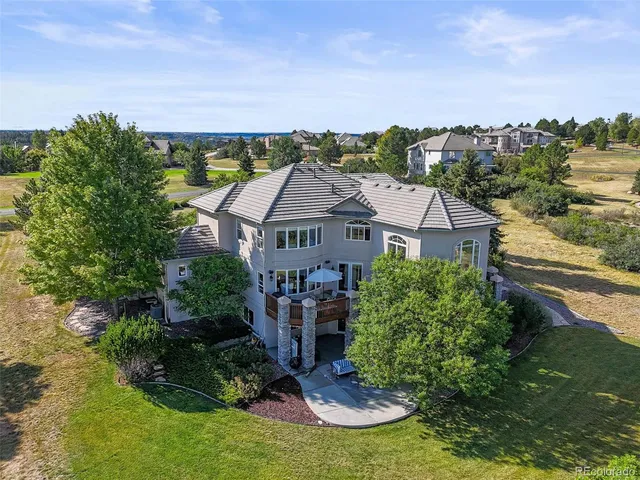 a aerial view of a house with a yard
