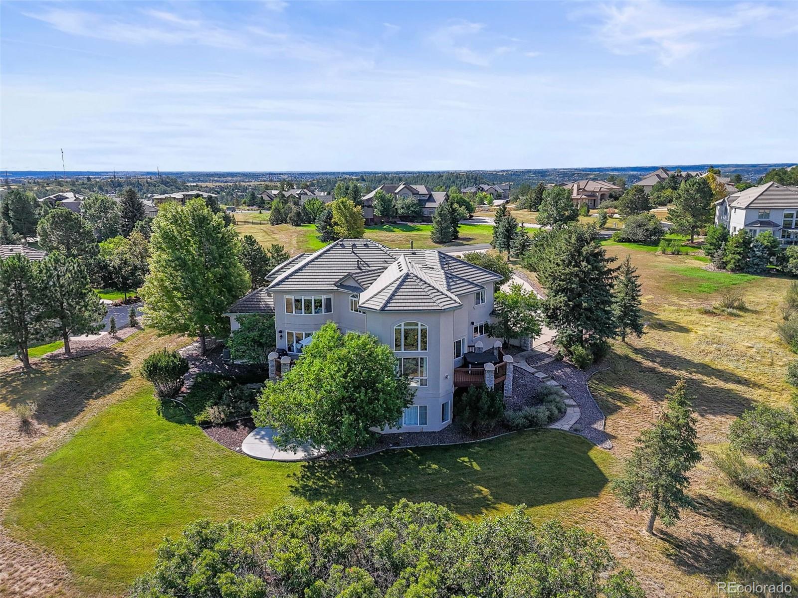 1289 Diamond Ridge Circle Castle Rock, CO 80108 - Photo 40 of 50 an aerial view of a house with a garden
