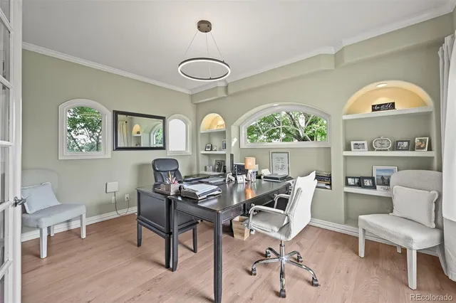 a dining room with furniture a rug and a large window