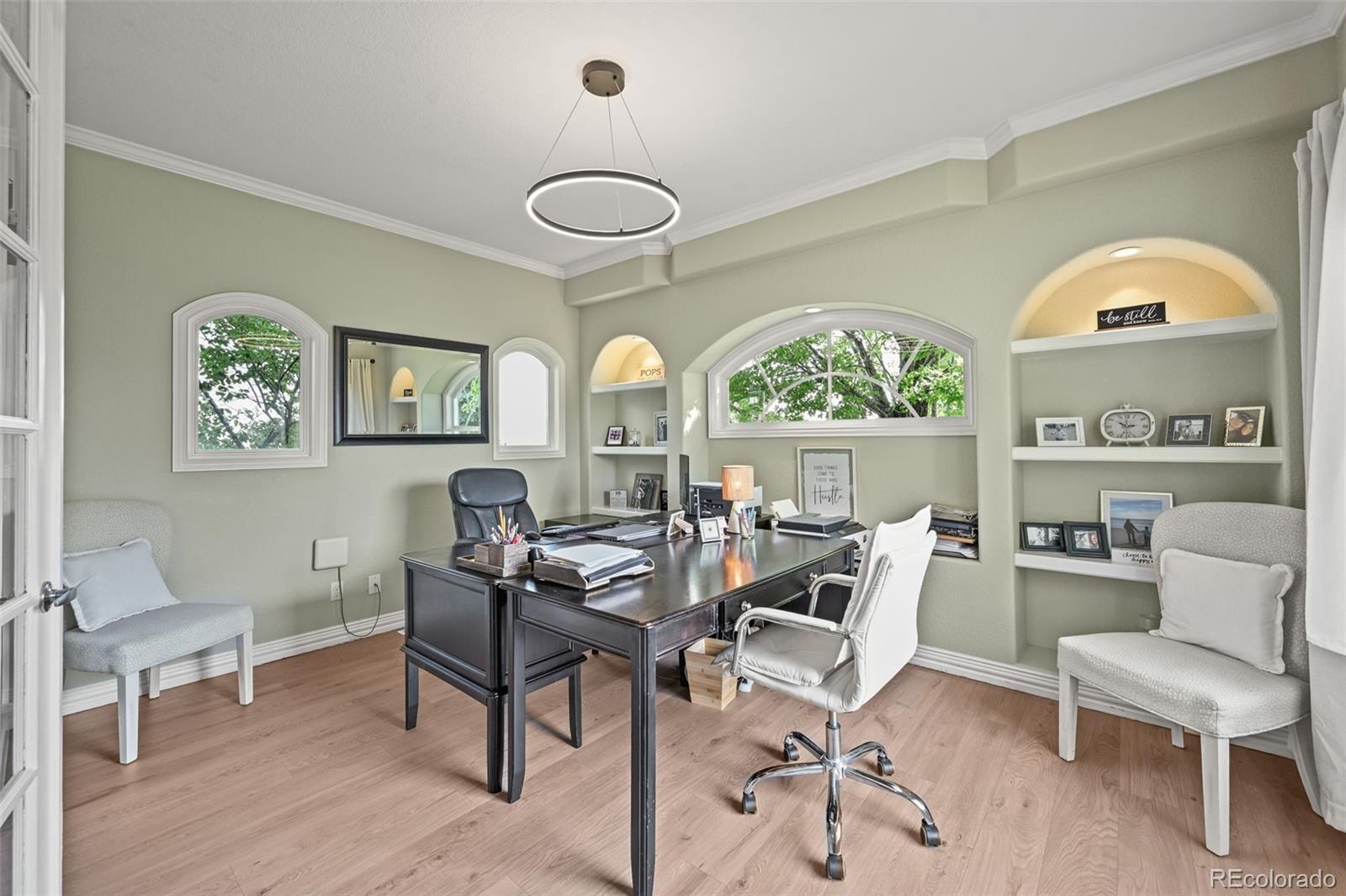 1289 Diamond Ridge Circle Castle Rock, CO 80108 - Photo 8 of 50 a dining room with furniture a rug and a large window