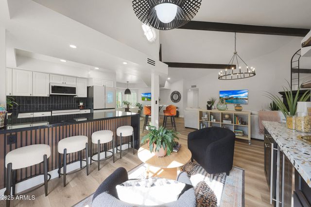 a view of backyard with a barn and a cactus plant