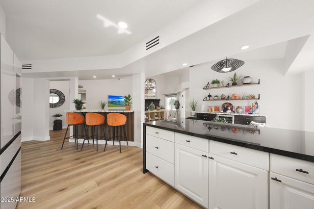 a kitchen with sink cabinets and window