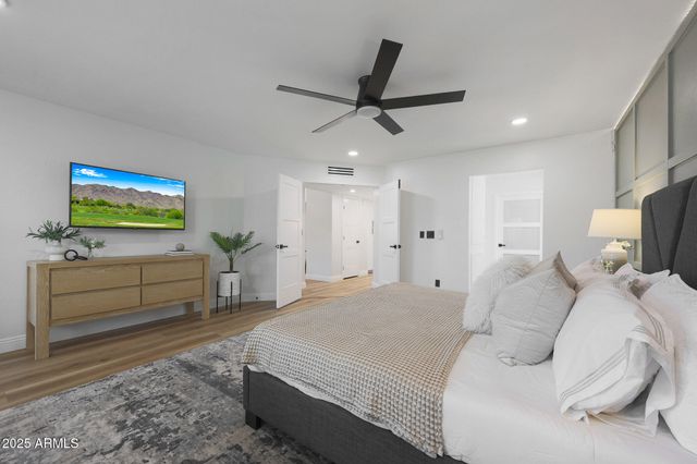 a large white bed in a white room