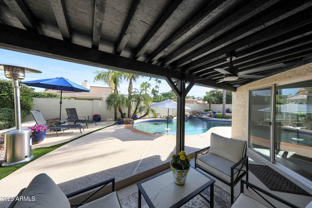 a porch with outdoor seating