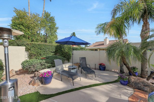 a view of a swimming pool with a yard