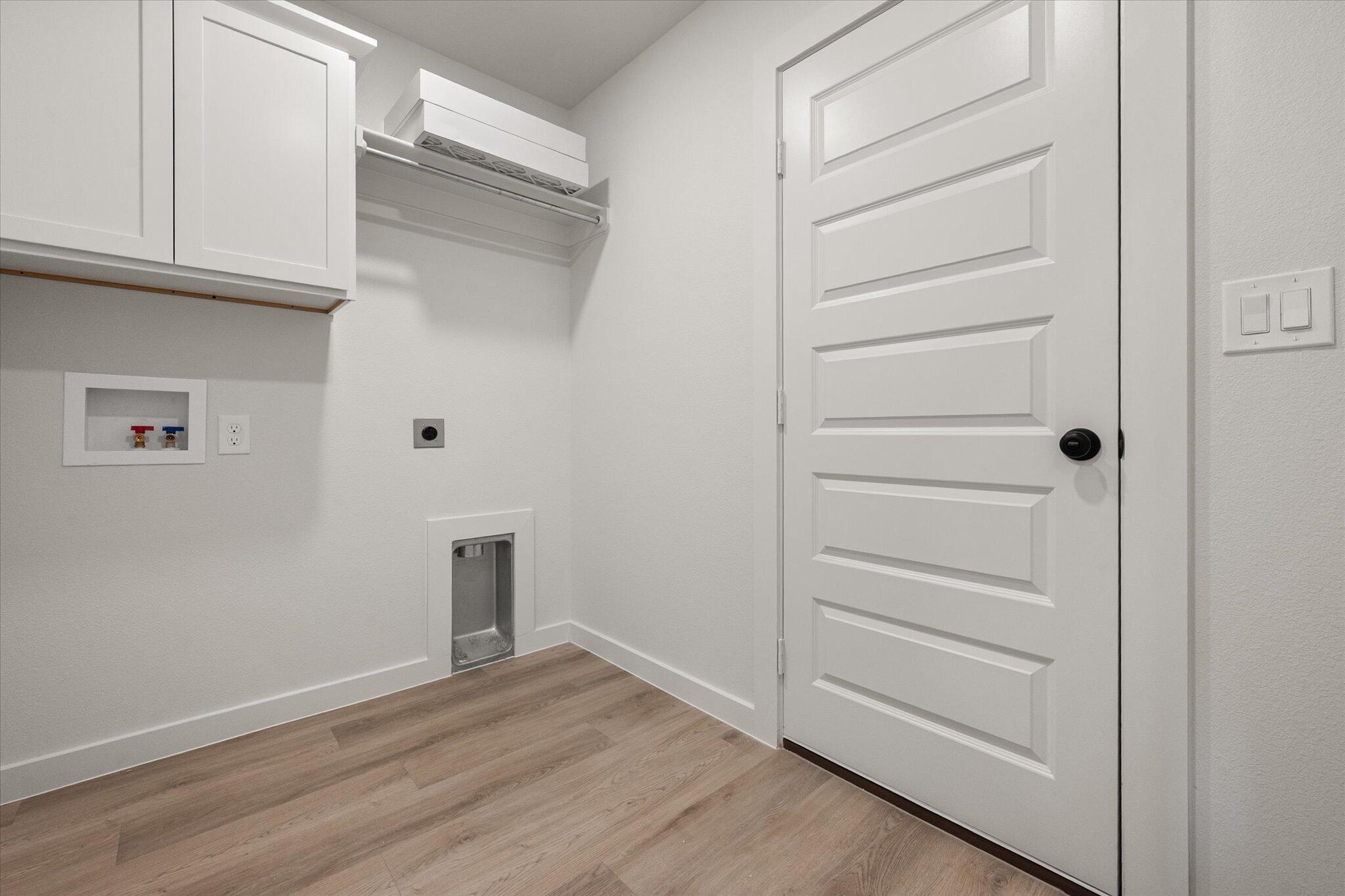 606 East 22nd Street Wolfforth, TX 79382 - Photo 18 of 19 a view of walk in closet with empty racks