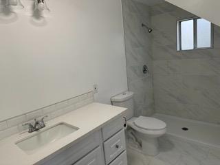 7828 Old Auburn Road Citrus Heights, CA 95610 - Photo 10 of 12 a bathroom with a sink toilet and shower
