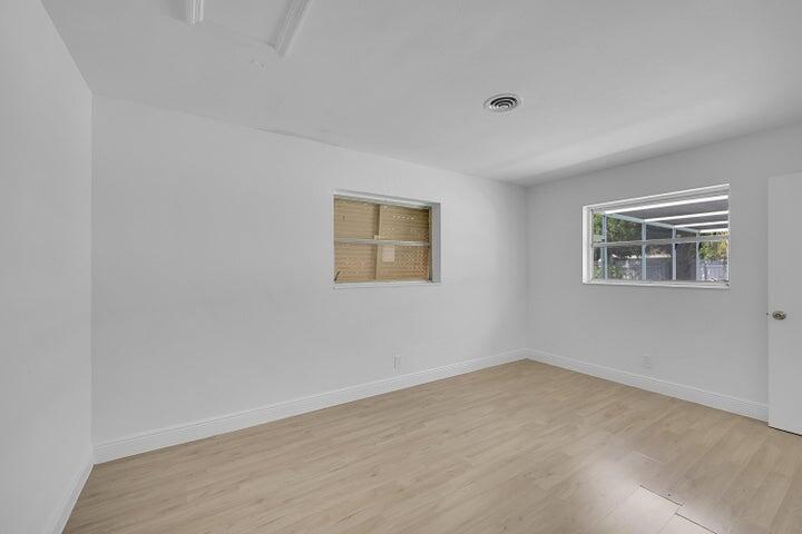 1308 South Congress Avenue Delray Beach, FL 33445 - Photo 15 of 30 a view of an empty room with a window