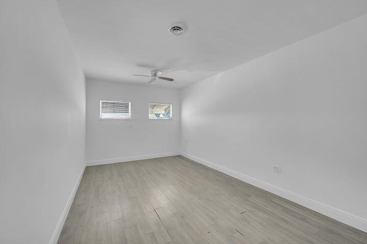 1308 South Congress Avenue Delray Beach, FL 33445 - Photo 17 of 30 wooden floor in a empty room