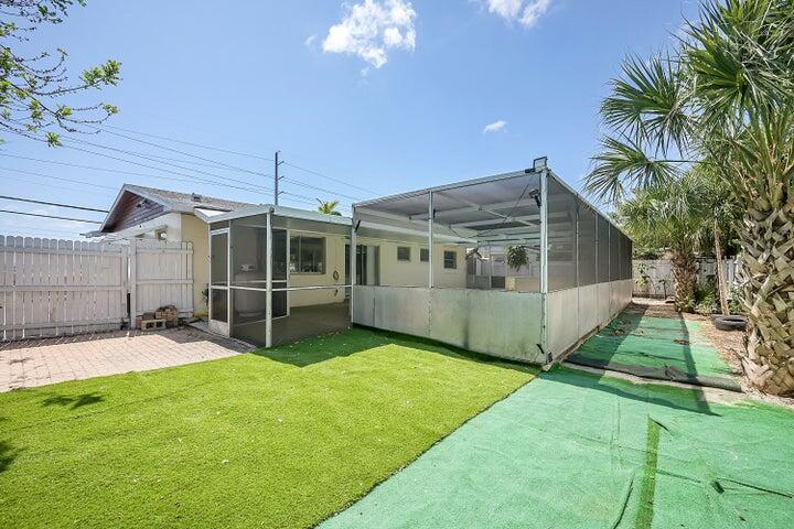 1308 South Congress Avenue Delray Beach, FL 33445 - Photo 9 of 30 a view of a house with a yard and sitting area