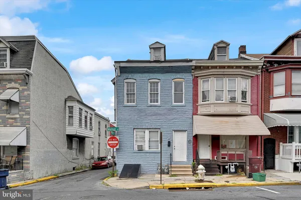 a front view of a building with street view