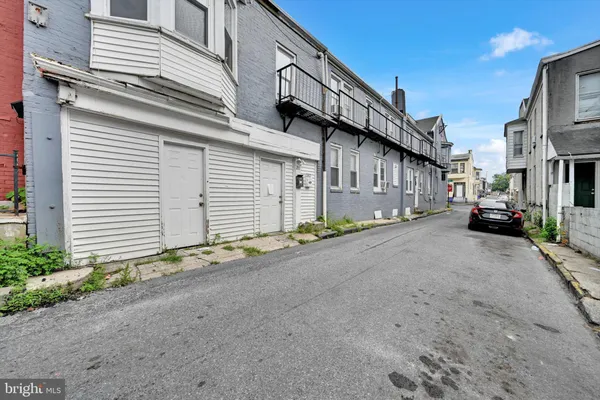 a view of a house with a street