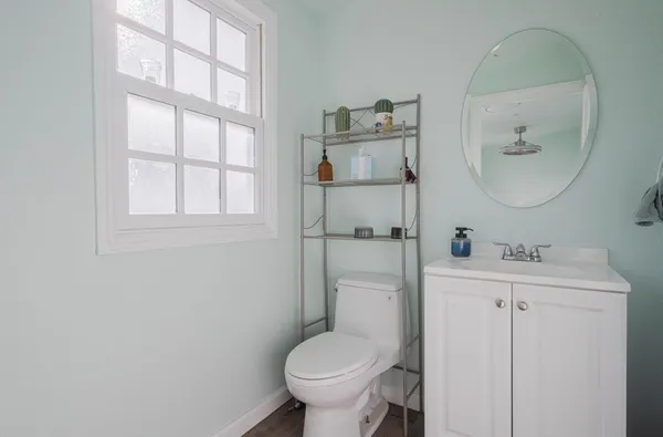 a view of a house with wooden deck