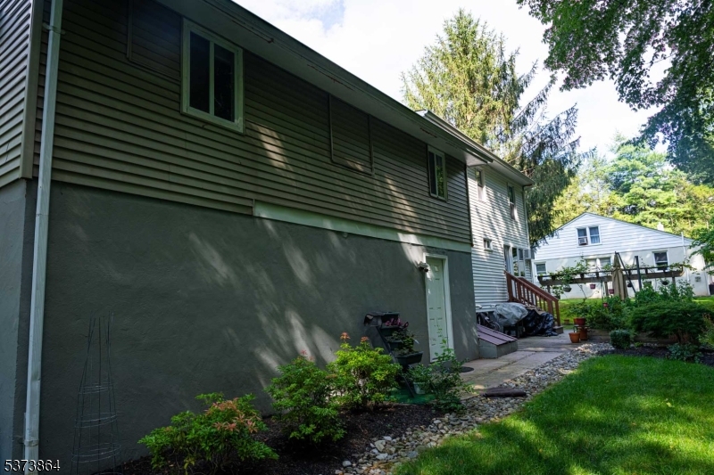 72 East Main Street High Bridge, NJ 08829 - Photo 30 of 35 a backyard of a house with plants and tree