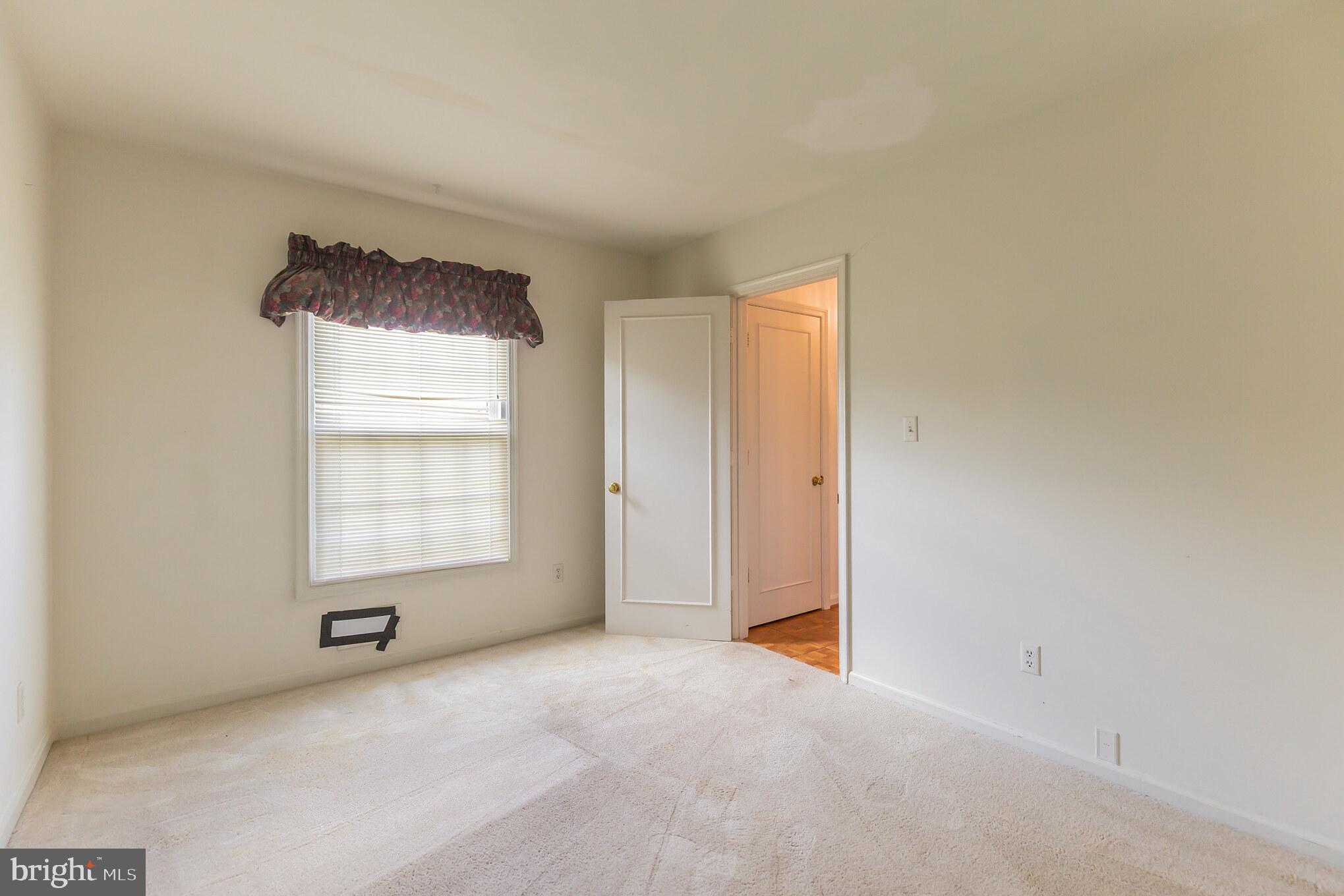 8314 Wickham Road Springfield, VA 22152 - Photo 16 of 31 Main floor bedroom/office with carpeted floor