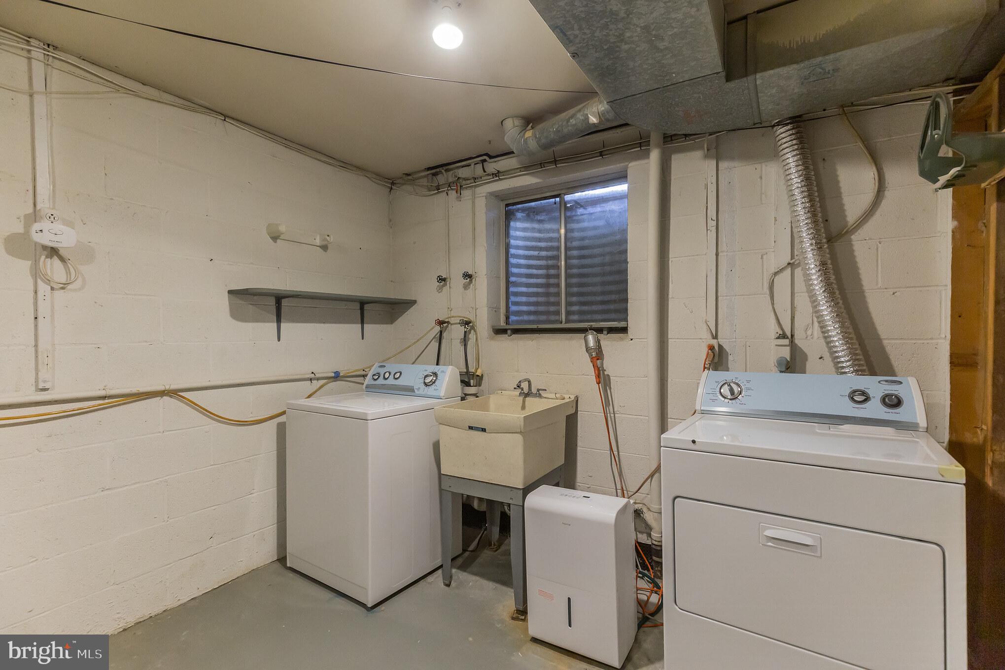 8314 Wickham Road Springfield, VA 22152 - Photo 23 of 31 Separate Laundry Room W/ Washer and Dryer