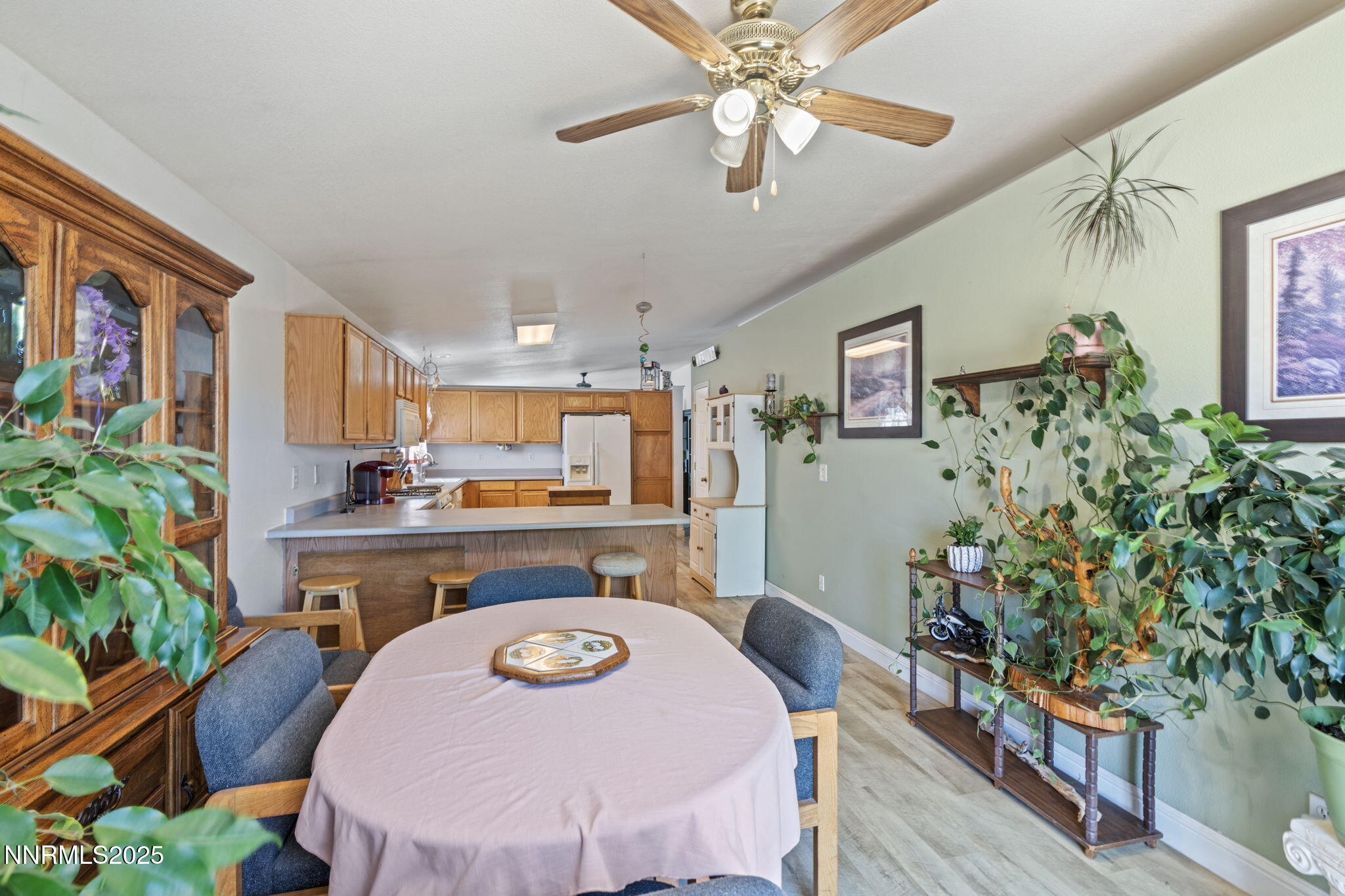 5886 Wishbone Court Sun Valley, NV 89433 - Photo 14 of 42 a view of a dining room with furniture and wooden floor