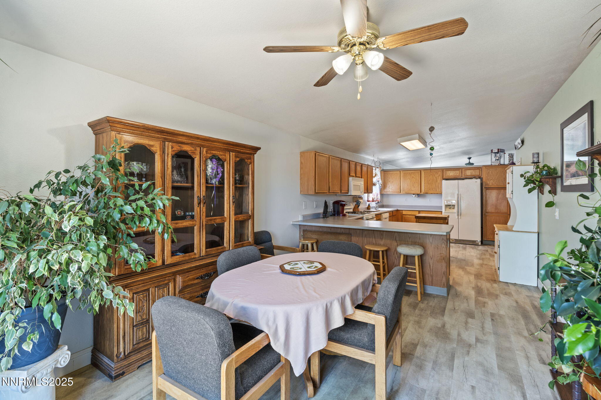 5886 Wishbone Court Sun Valley, NV 89433 - Photo 15 of 42 a view of a dining room with furniture window and wooden floor