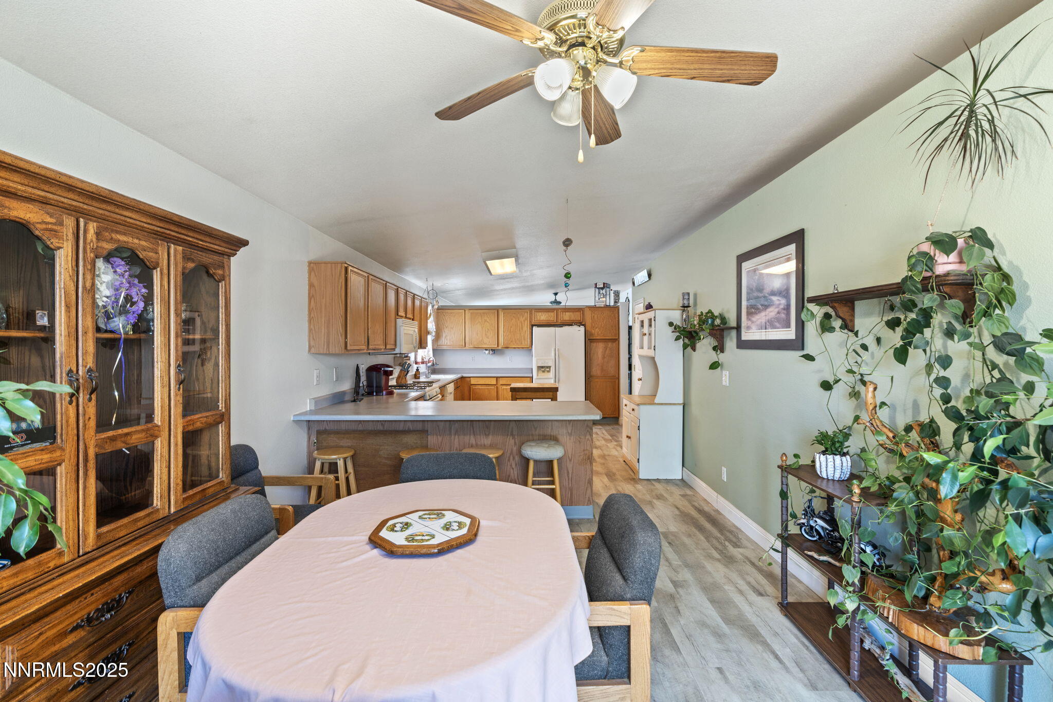 5886 Wishbone Court Sun Valley, NV 89433 - Photo 16 of 42 a living room with furniture and a wooden floor