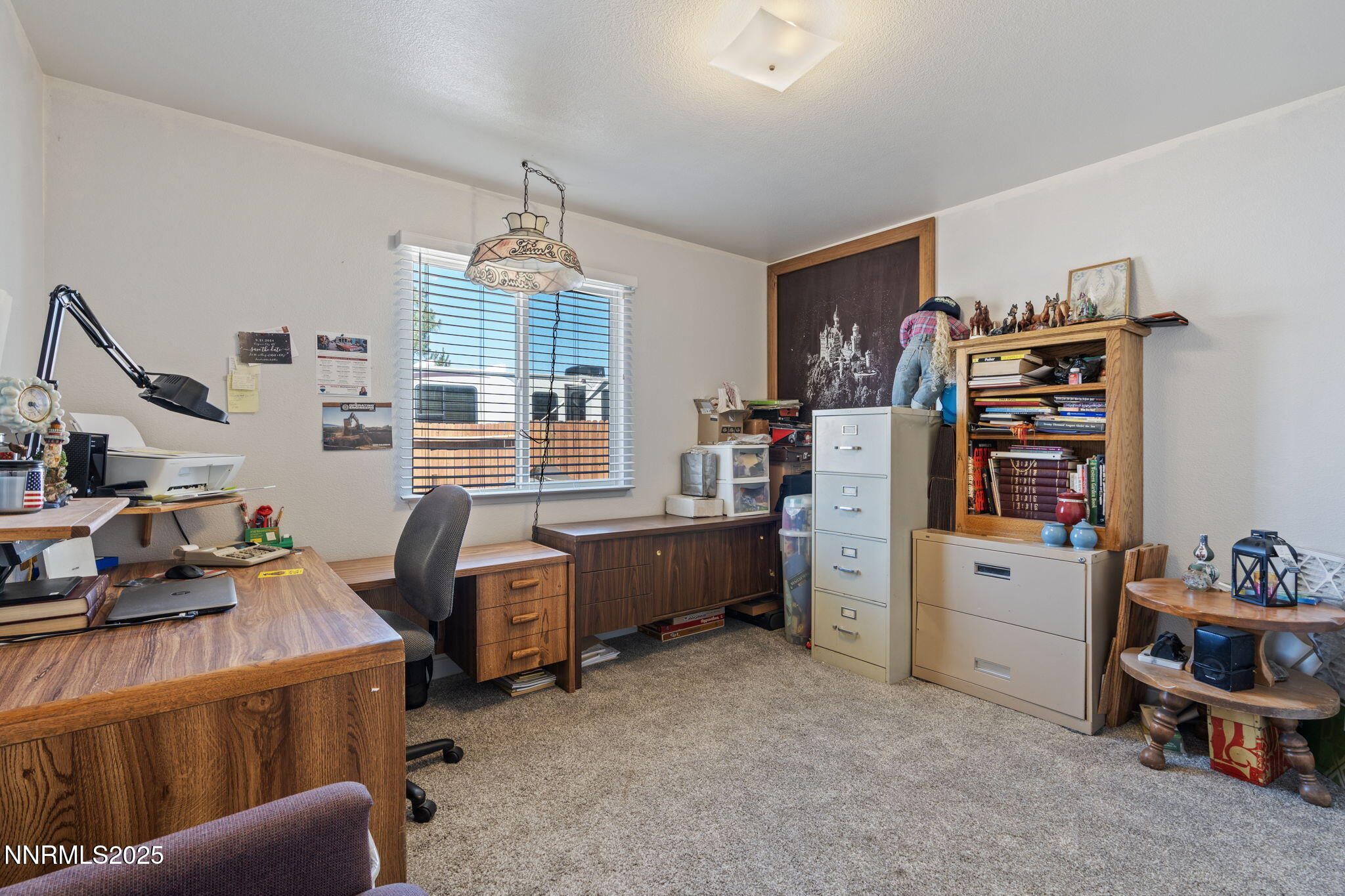 5886 Wishbone Court Sun Valley, NV 89433 - Photo 28 of 42 a room with furniture and white walls