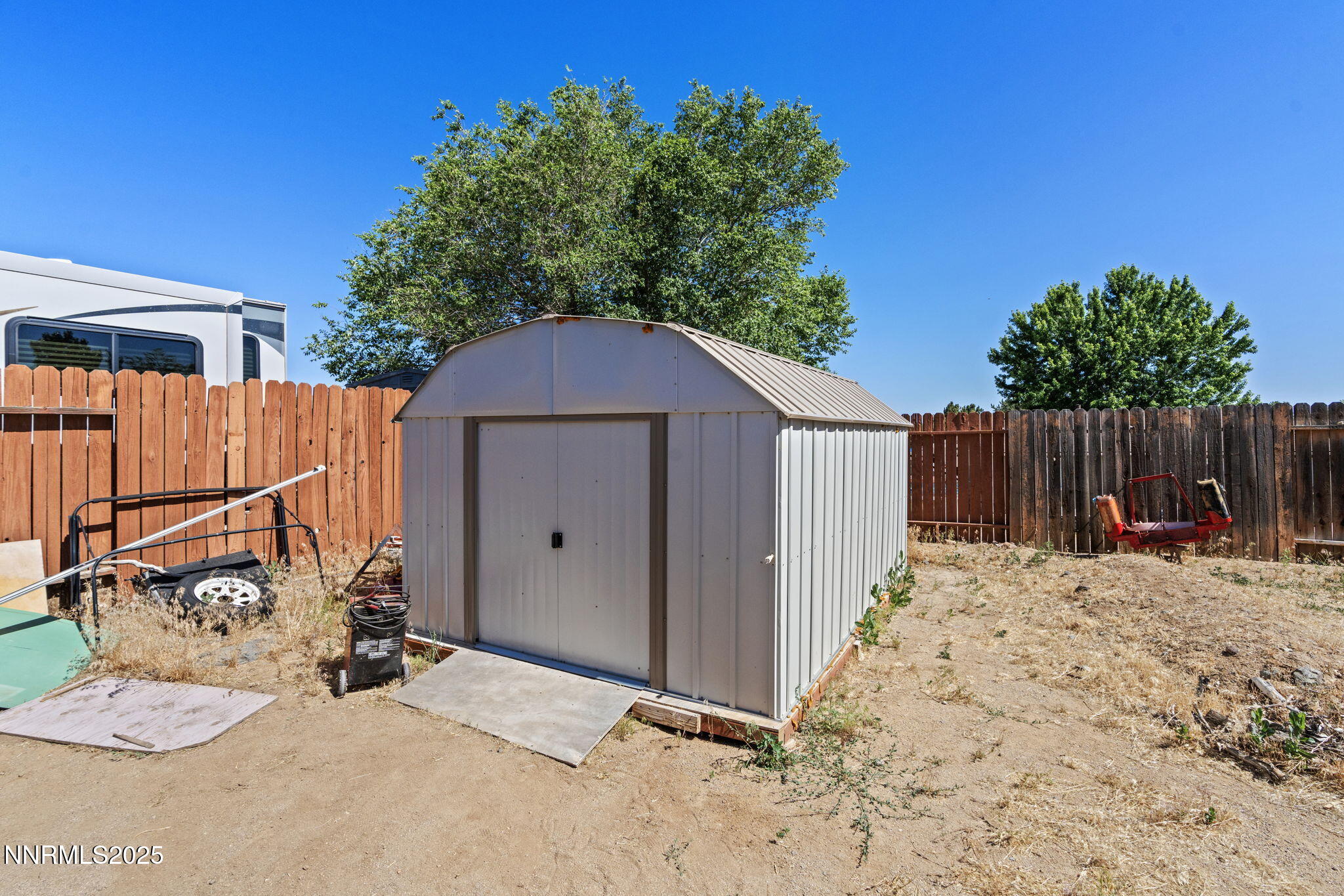 5886 Wishbone Court Sun Valley, NV 89433 - Photo 33 of 42 a backyard of a house with table and chairs