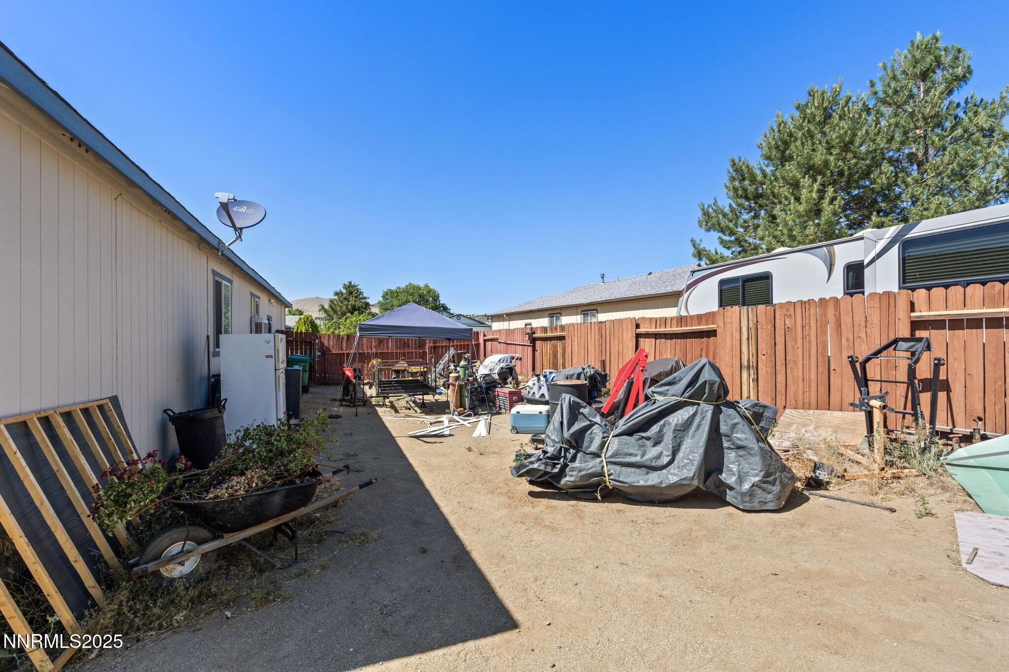 5886 Wishbone Court Sun Valley, NV 89433 - Photo 36 of 42 a view of a patio with chairs and potted plants