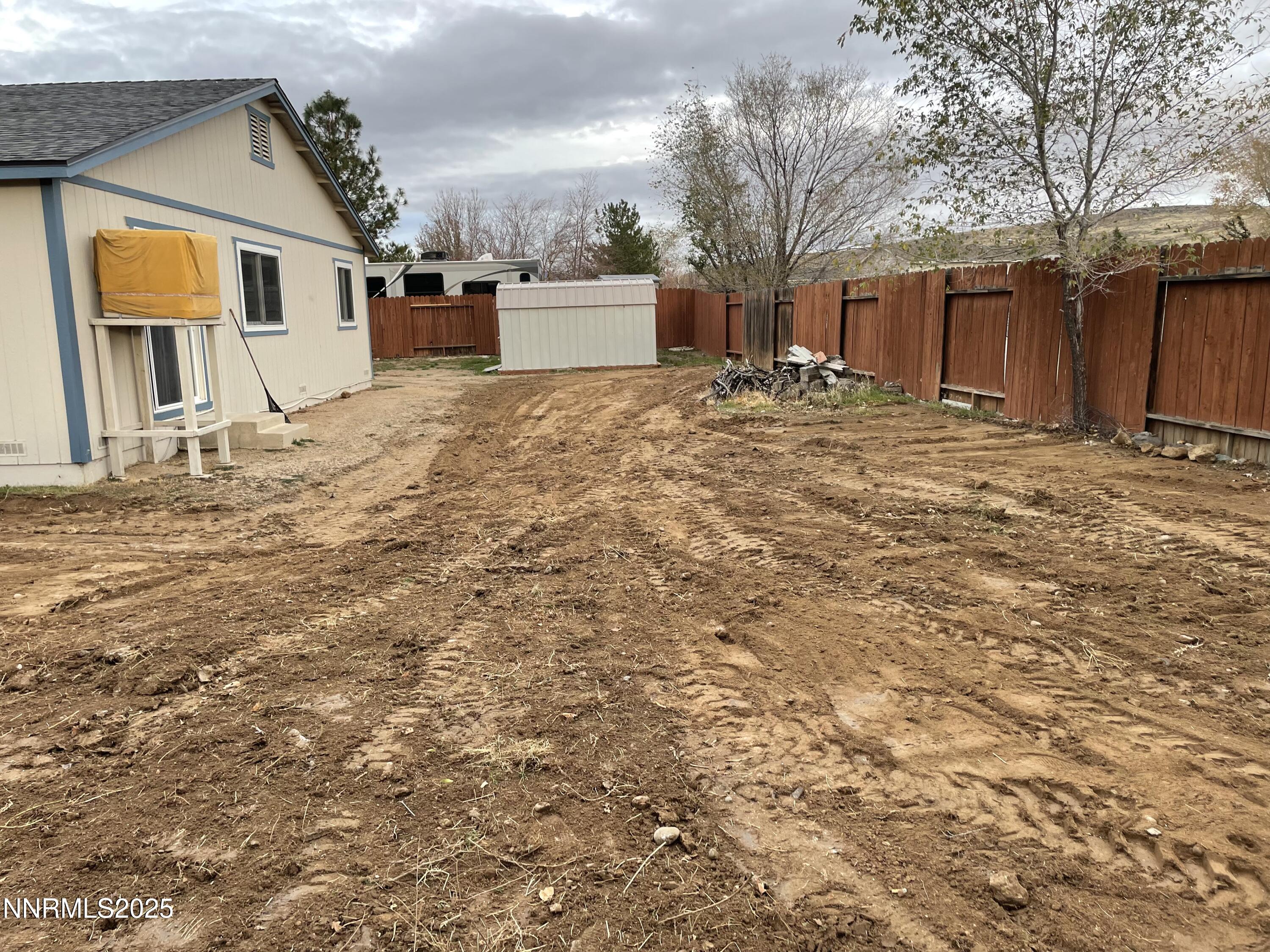 5886 Wishbone Court Sun Valley, NV 89433 - Photo 42 of 42 a view of a house with a snow in the yard