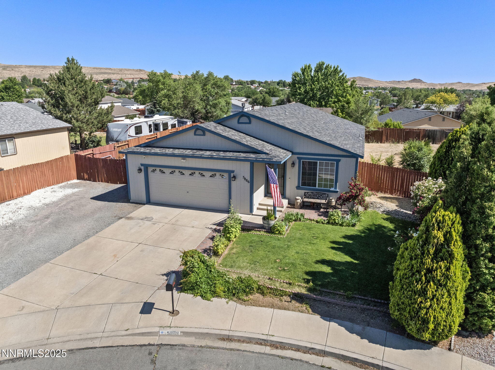 5886 Wishbone Court Sun Valley, NV 89433 - Photo 5 of 42 a front view of a house with garden