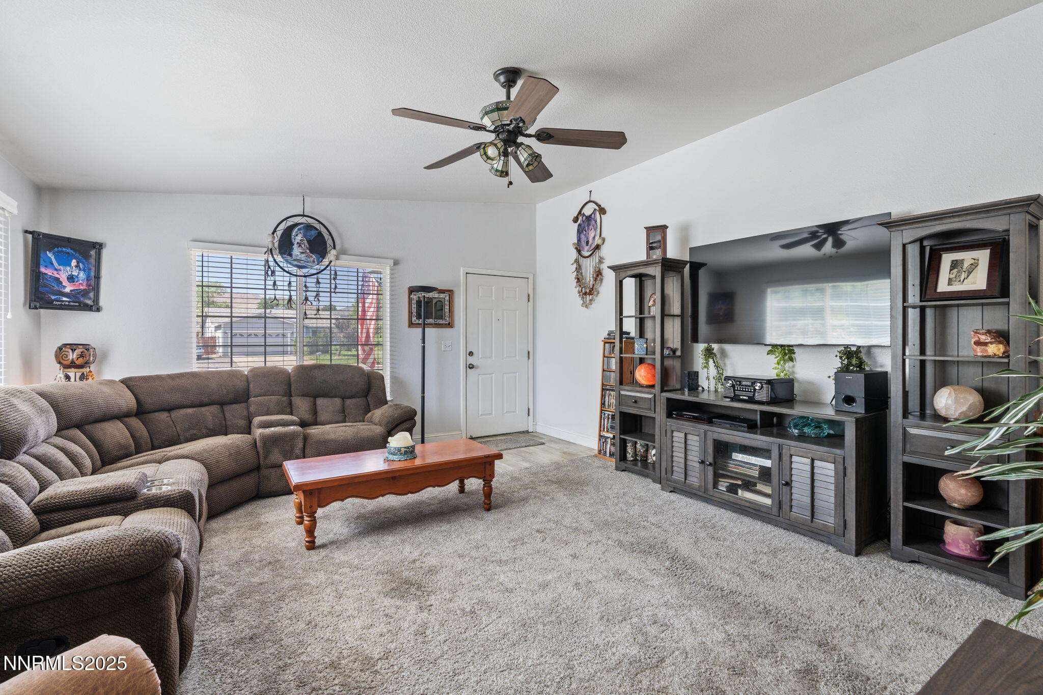 5886 Wishbone Court Sun Valley, NV 89433 - Photo 10 of 42 a living room with furniture and a flat screen tv