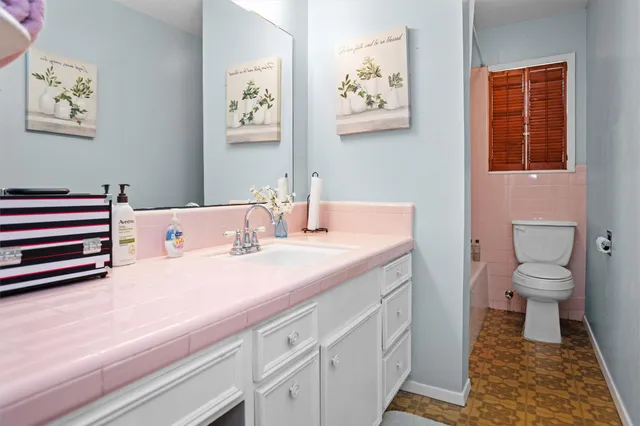 a bathroom with a sink and a toilet