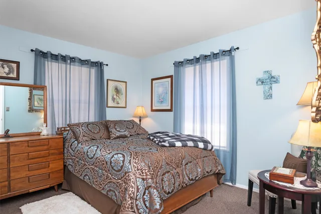 a bedroom with a bed and furniture