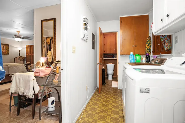 a bed room with a bed window and a couch