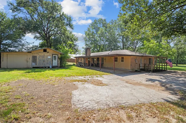 a front view of a house with a yard and a garage
